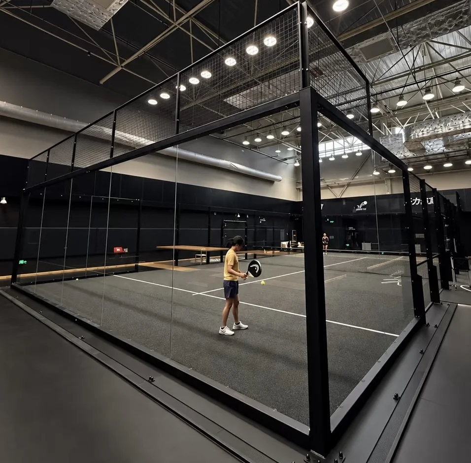 Indoor padel court with glass walls and black steel frame by Dream Courts in Beijing