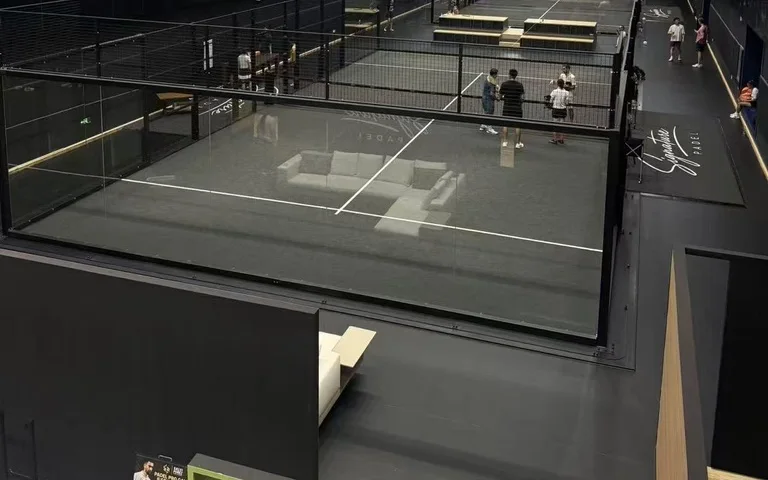 Indoor padel court with glass walls by Dream Courts in Beijing